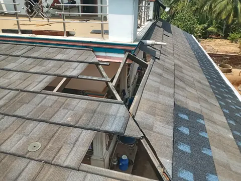 Stone-coated steel roof with ridge capping